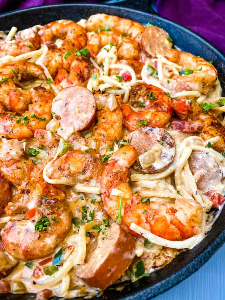 cajun shrimp pasta with low carb pasta in a cast iron skillet