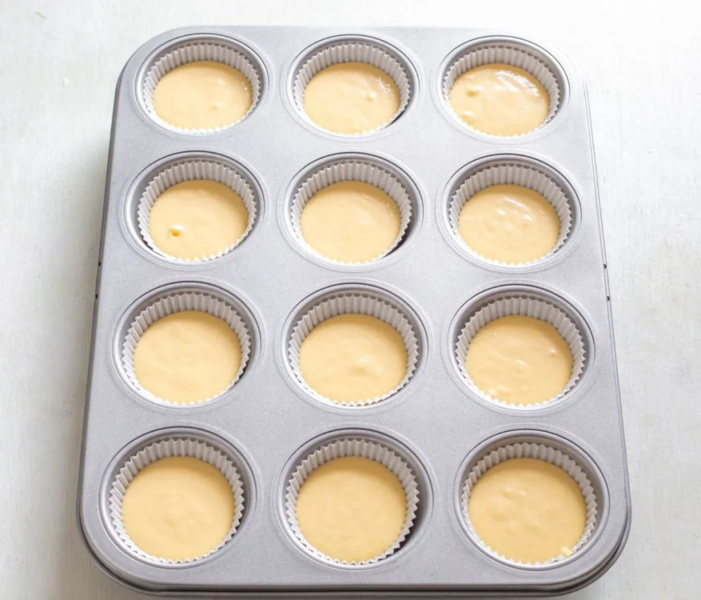 unbaked cupcakes in a muffin tin