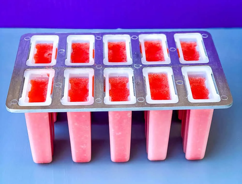 sugar free lemon strawberry mix in a popsicle mold