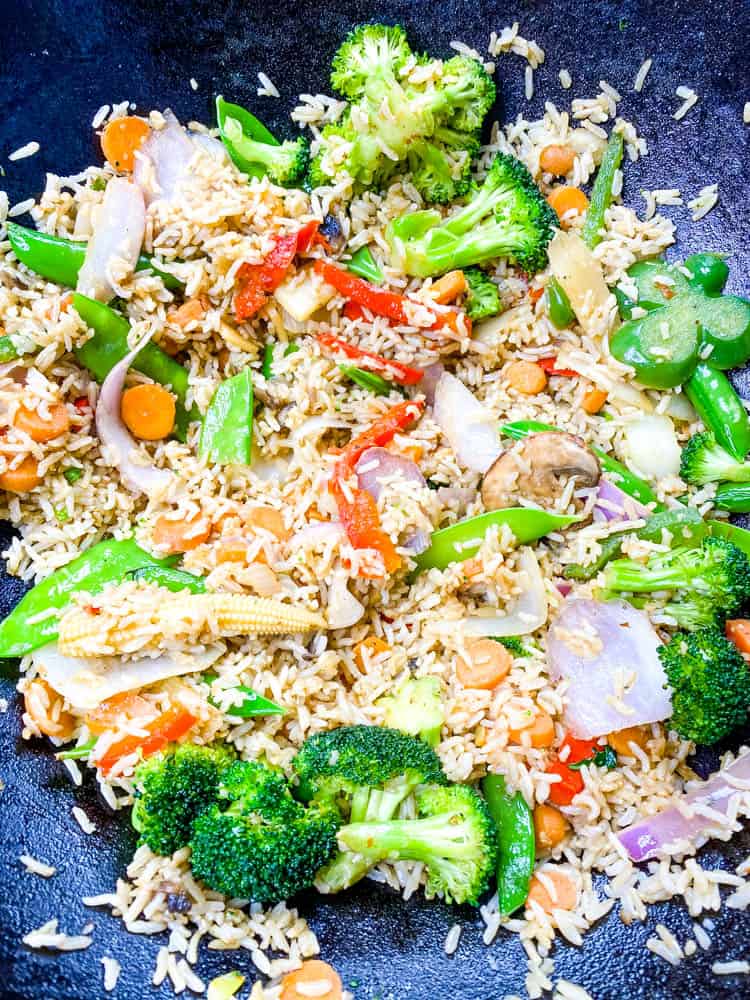 salmon fried rice in a cast iron wok