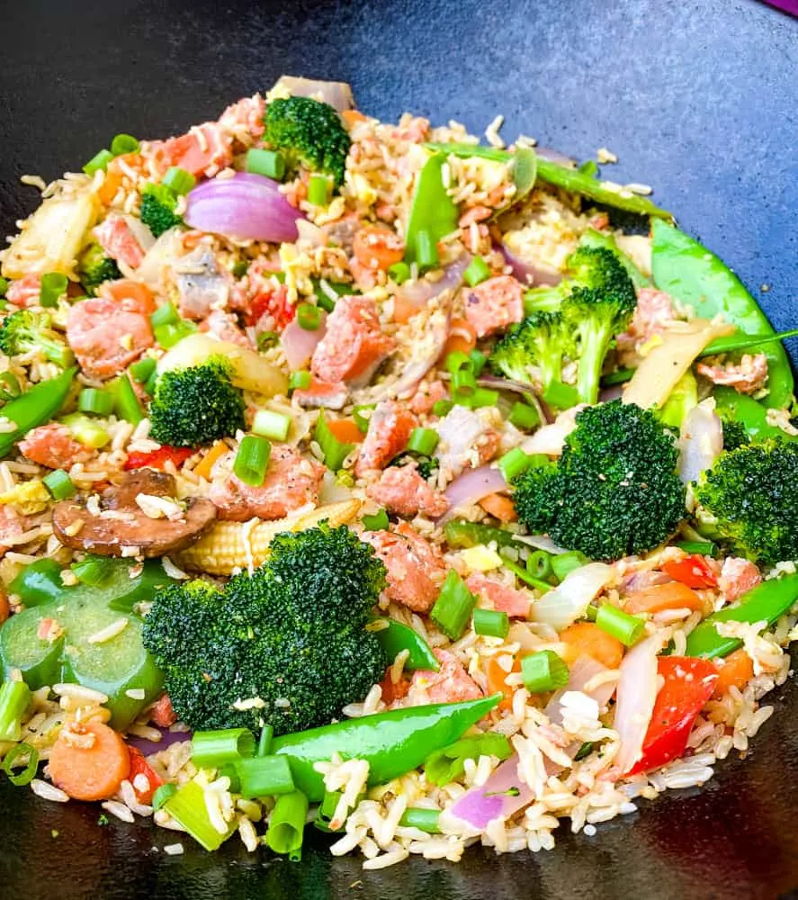 salmon fried rice in a cast iron wok