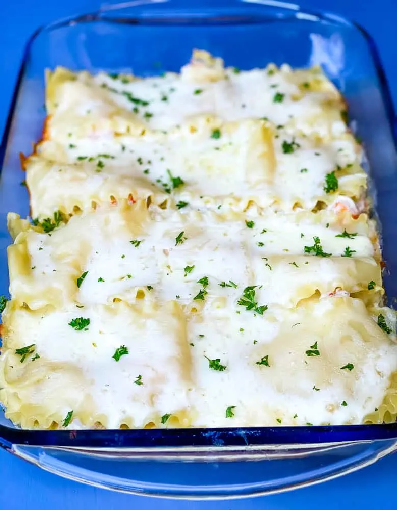 seafood lasagna in a glass baking dish