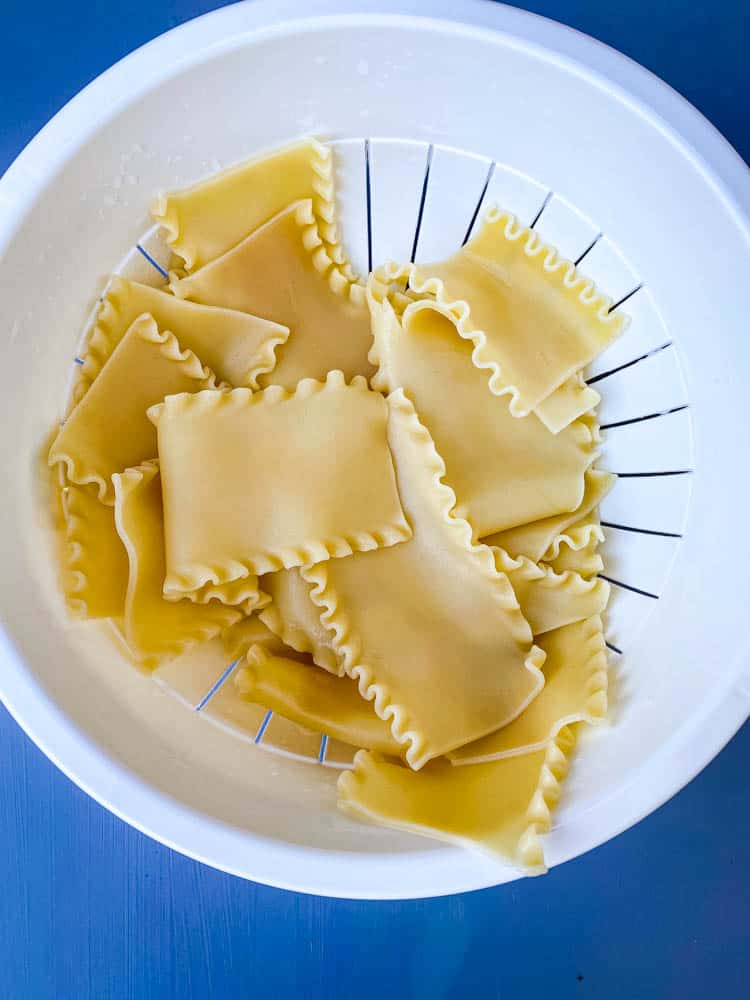 cooked lasagna noodles in a white bowl