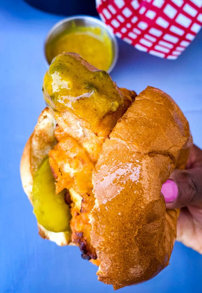 person holding chick-fil-a chicken sandwich