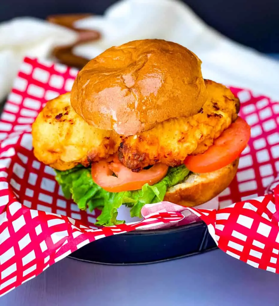 air fryer chick-fil-a chicken sandwich in a bowl with lettuce and tomato