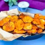 air fryer sweet potato chips in a black bowl with dipping sauce