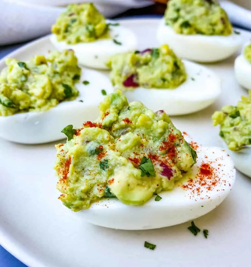 avocado deviled eggs with paprika on a