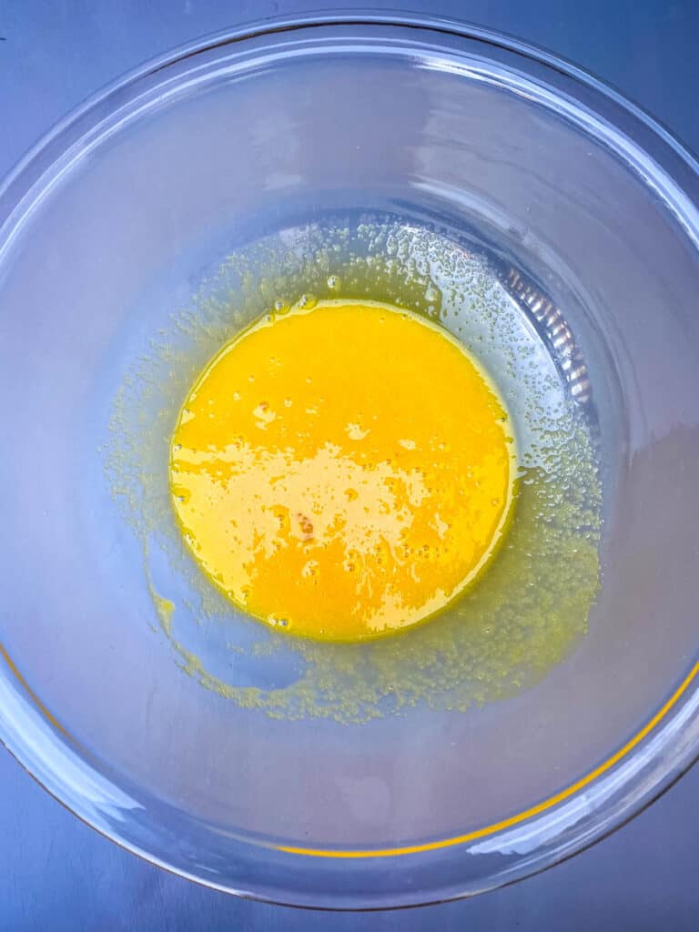 egg yolks mixed with sweetener in a glass bowl