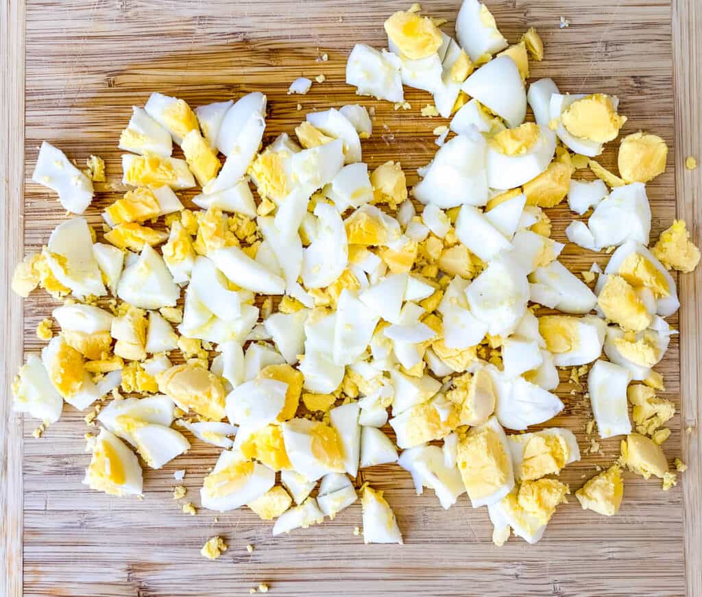 chopped hard boiled eggs on a cutting board