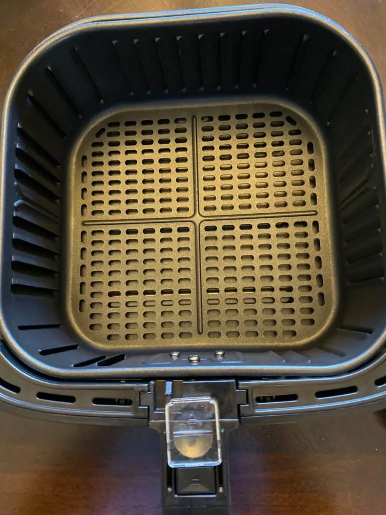 a clean air fryer basket on a flat surface