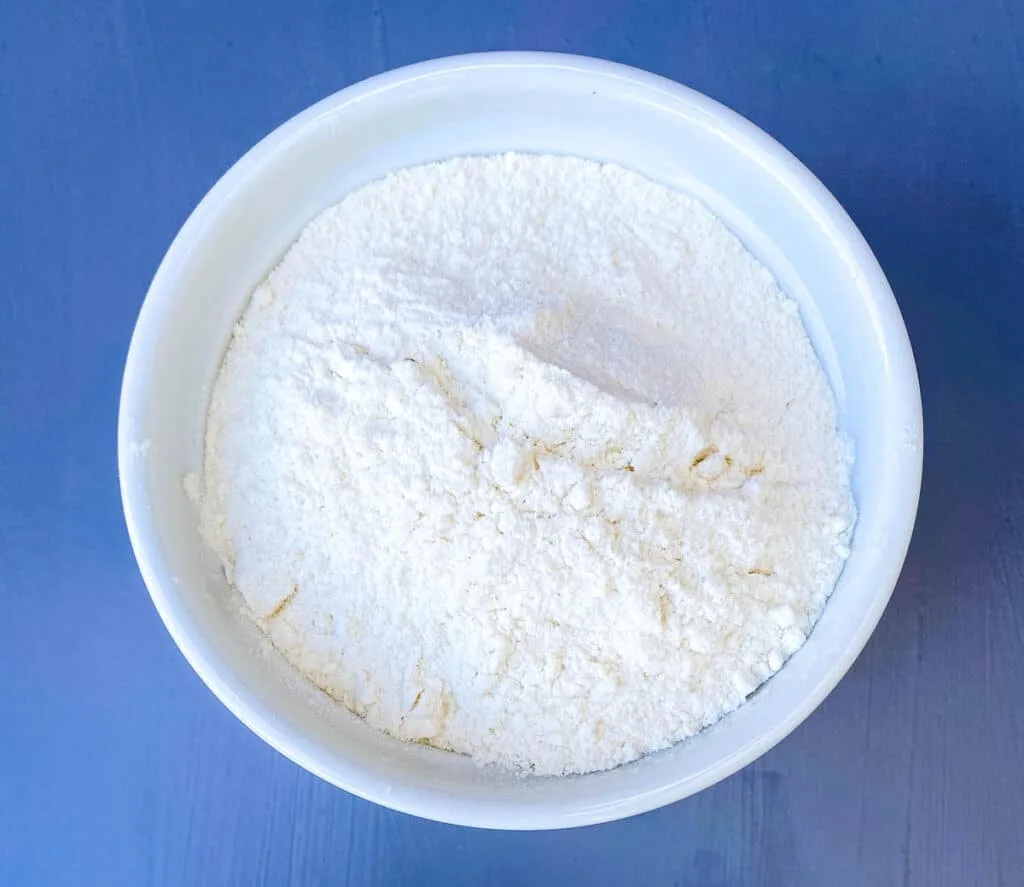 all purpose flour in a white bowl