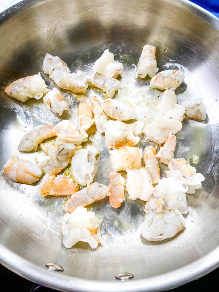 raw shrimp in a frying pan