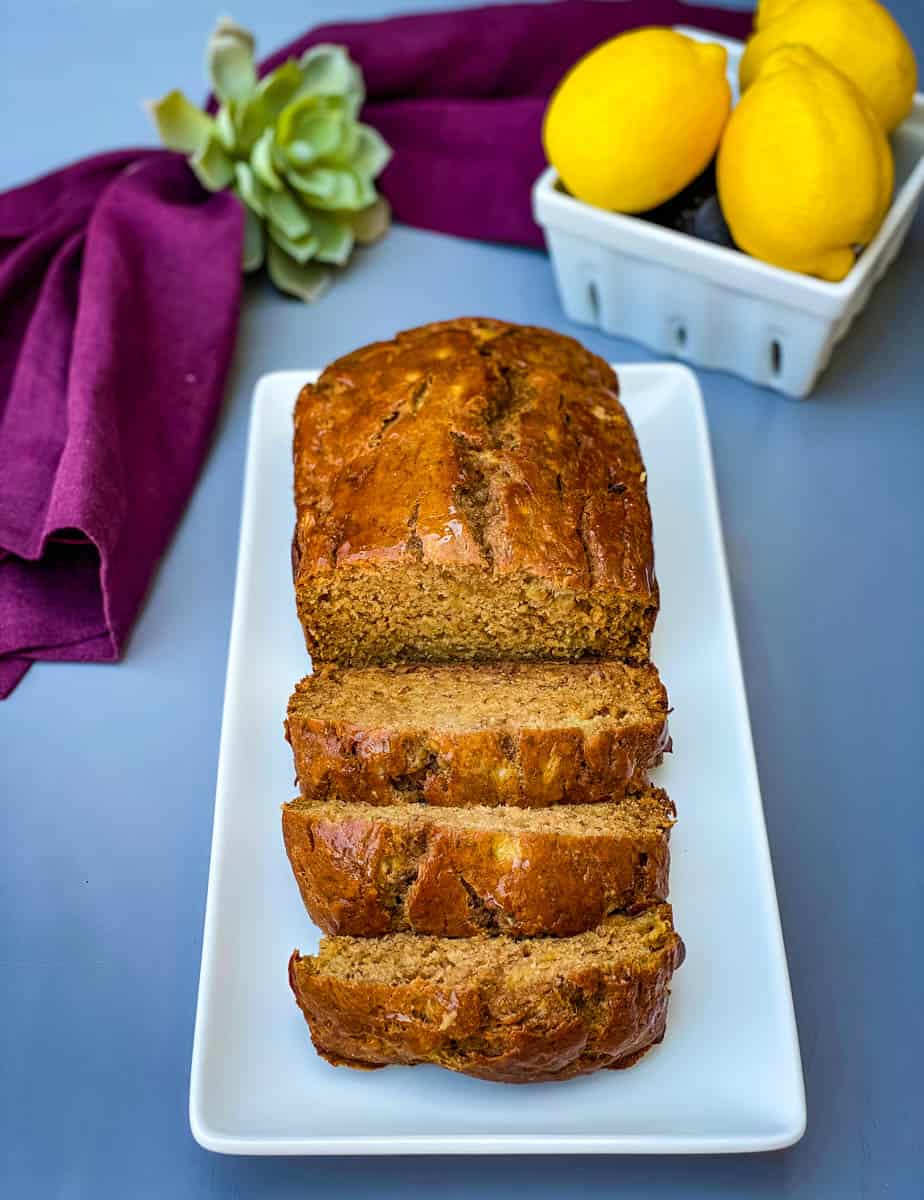 healthy banana bread sliced on a white plate