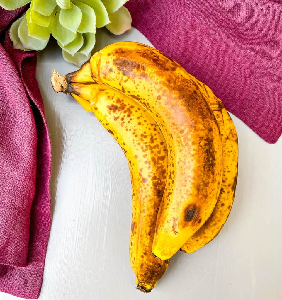 overripe bananas on a flat surface