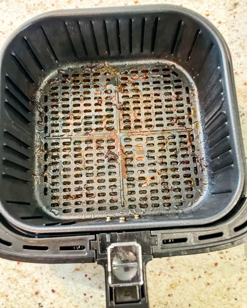 air fryer basket with water and dish liquid
