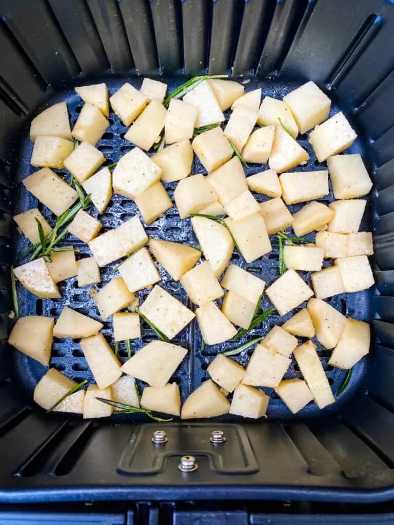 sliced potatoes in an air fryer