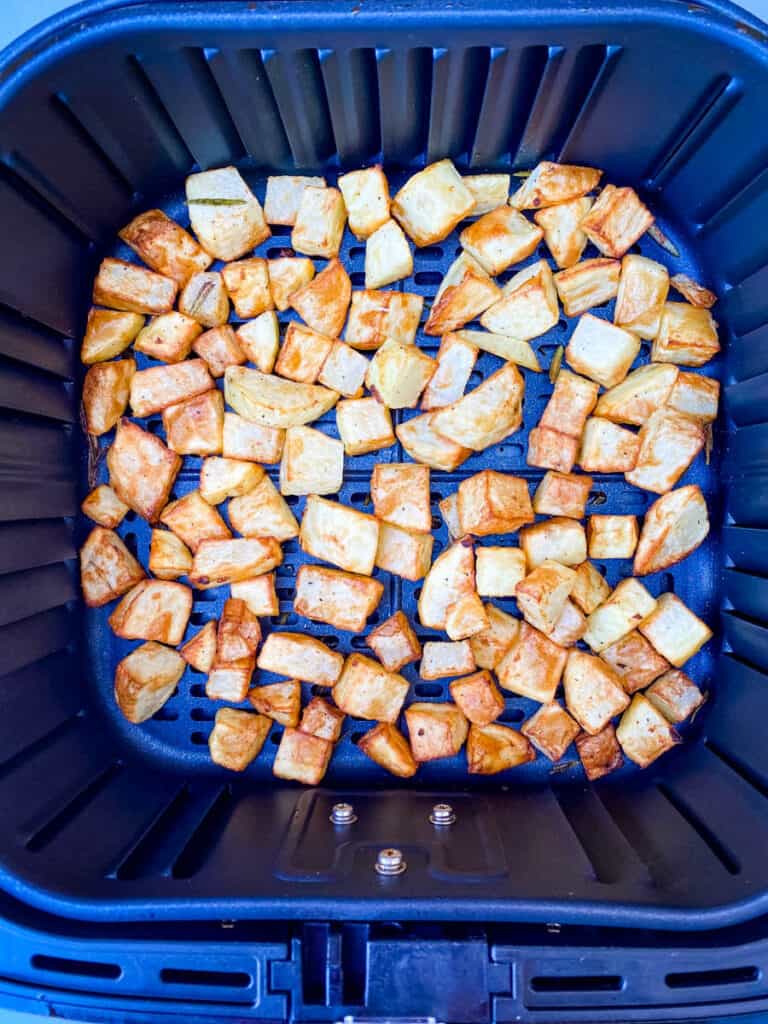 cooked roasted potatoes in an air fryer