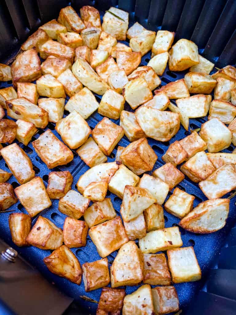 cooked roasted potatoes in an air fryer