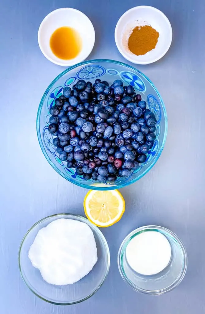 fresh blueberries, lemon, cornstarch, vanilla, sweetener, and cinnamon in separate bowls