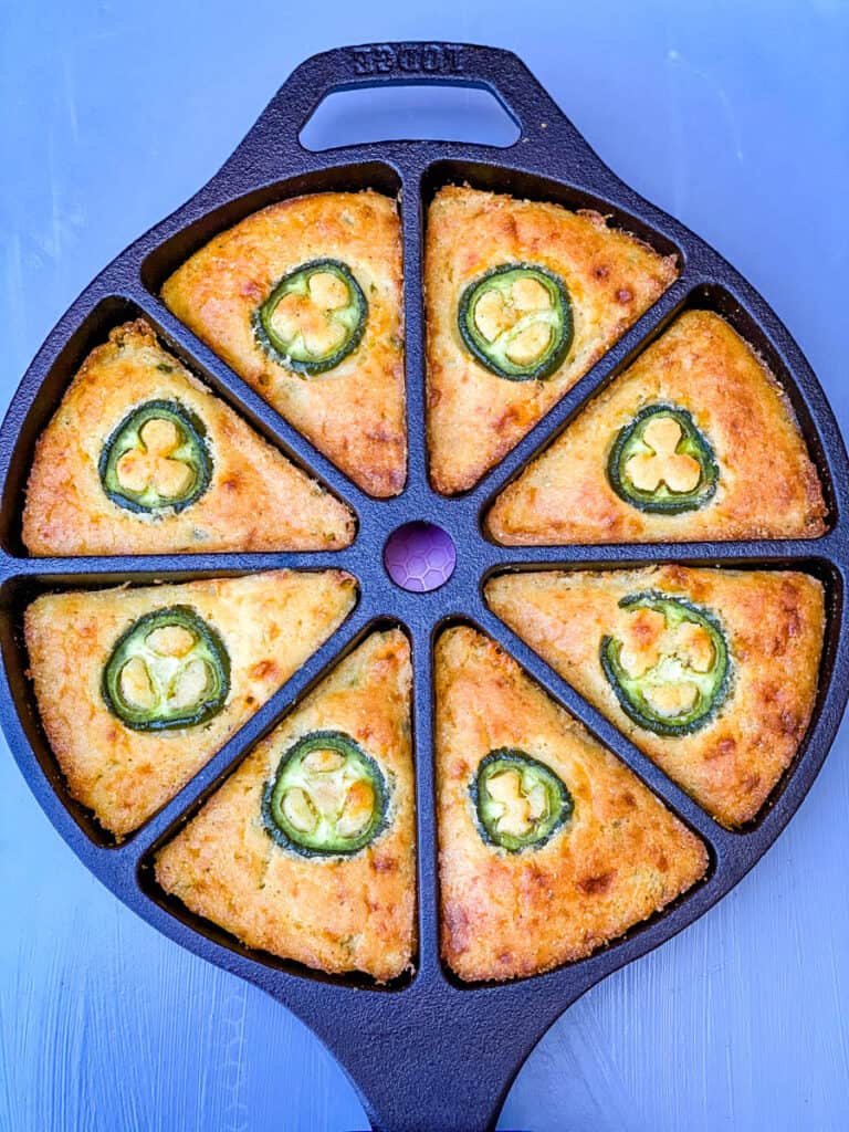 jalapeno cheddar cornbread in a cast iron wedge pan