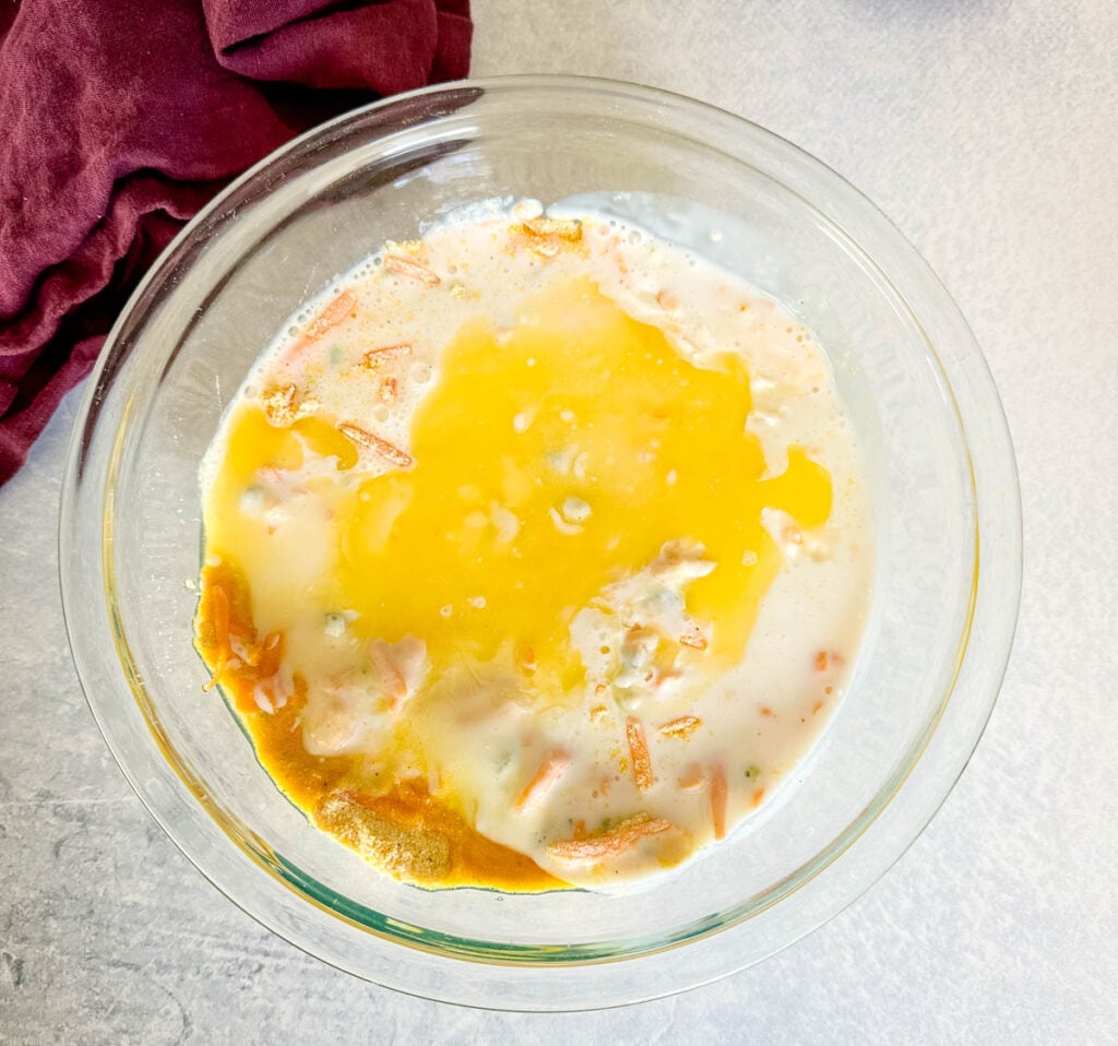 cornmeal, cheddar cheese, jalapenos, baking powder, buttermilk, and flour in a glass bowl