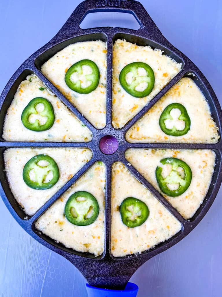 unbaked jalapeno cheddar in a cast iron wedge pan