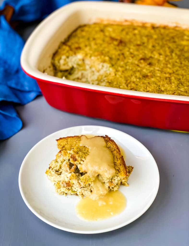 Southern cornbread dressing on a white plate with gravy