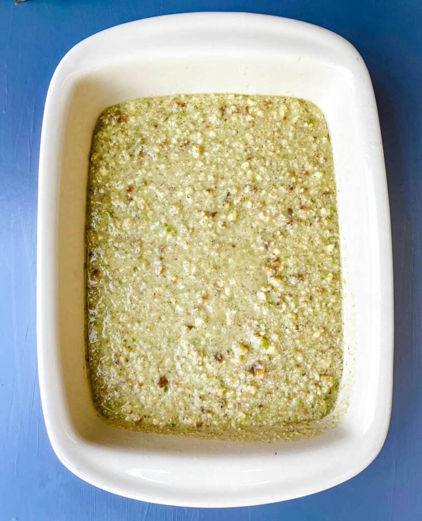 unbaked cornbread dressing in a baking dish