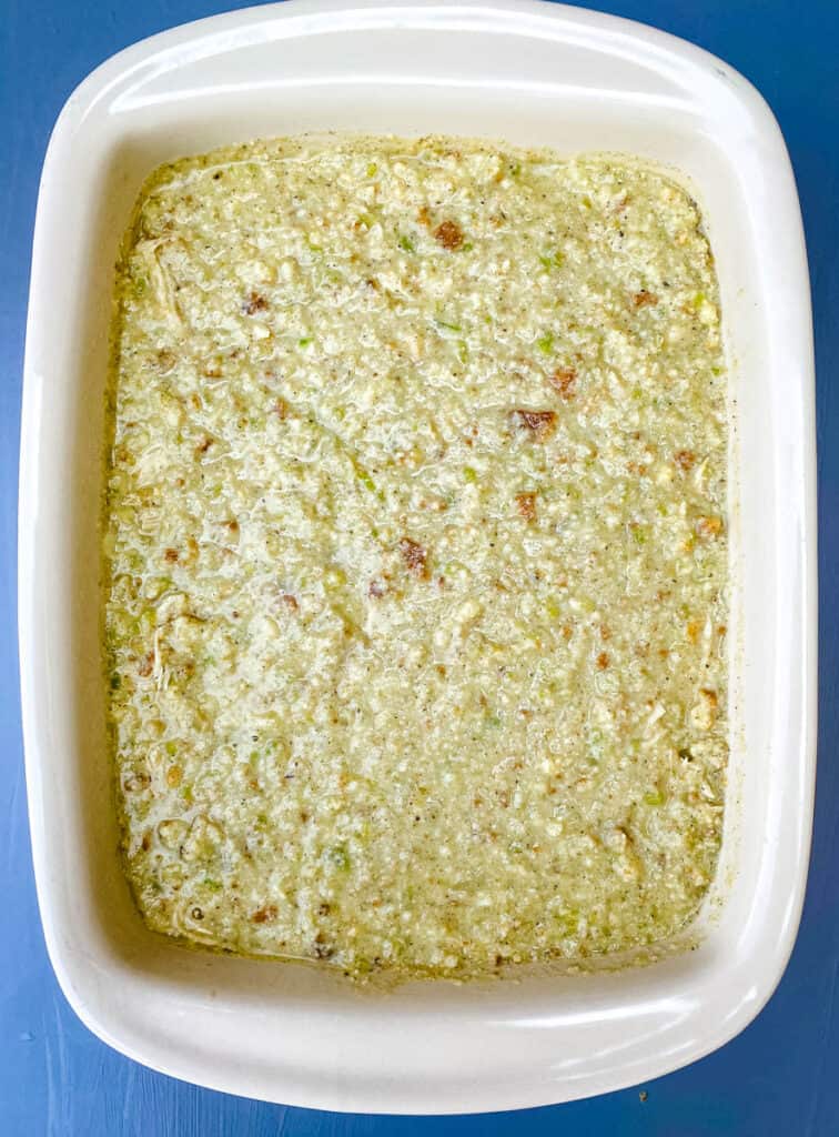 unbaked cornbread dressing in a baking dish