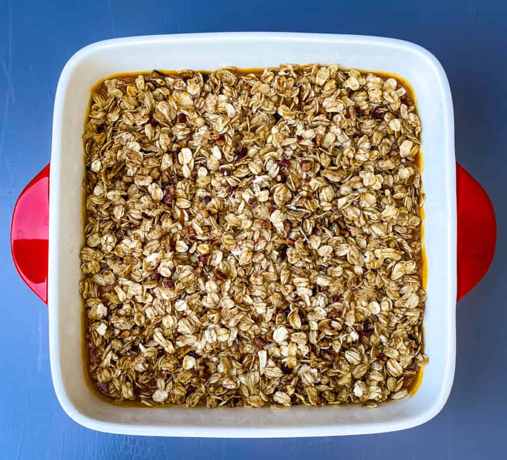 pumpkin crisp in a red baking dish