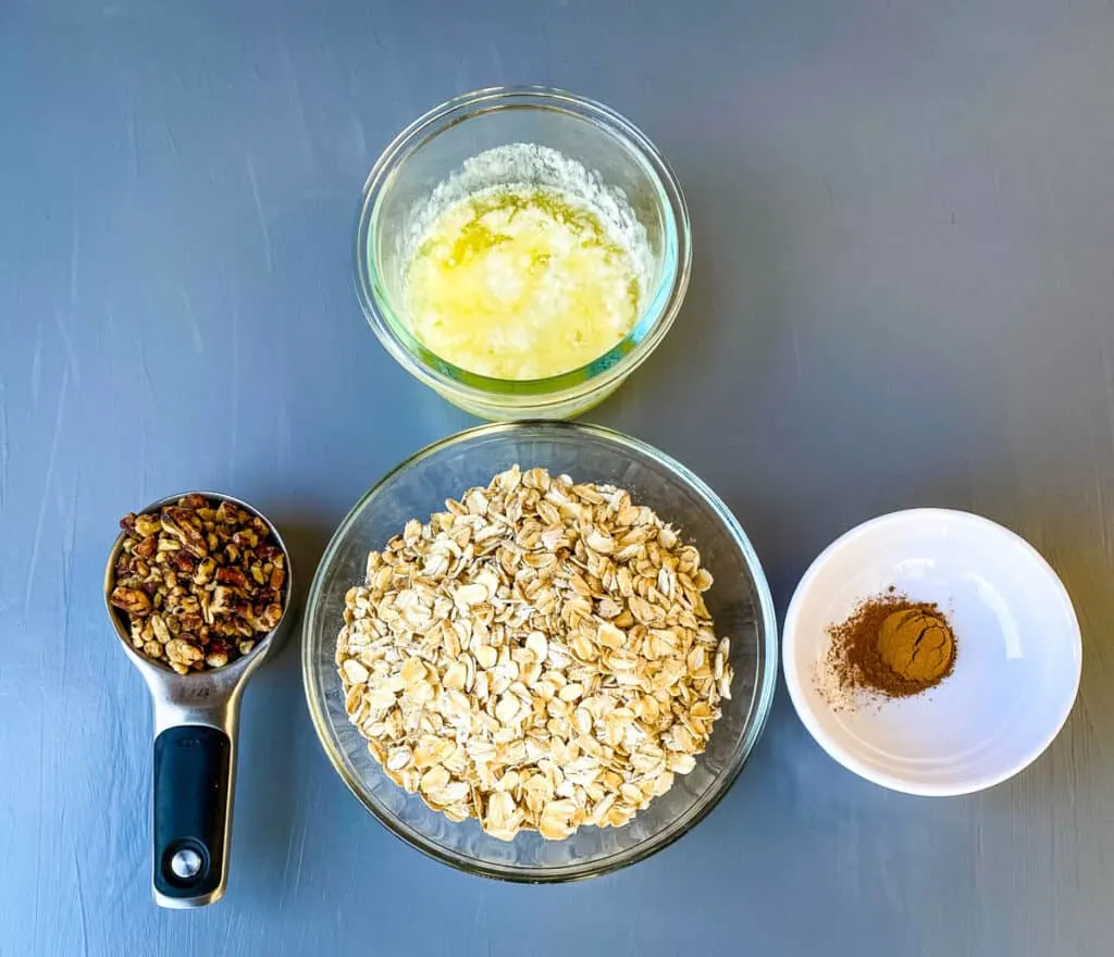 rolled oats, pecans, cinnamon, and melted butter in separate bowls
