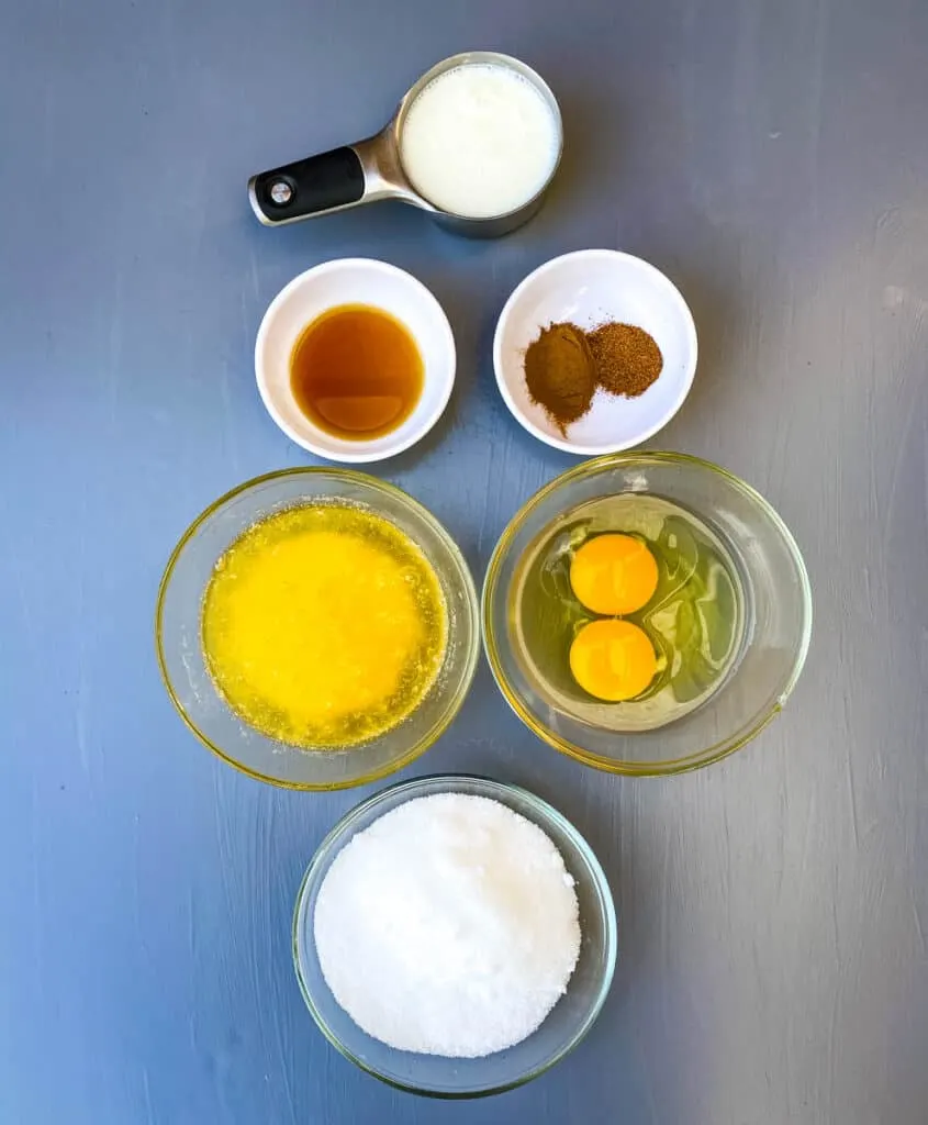 buttermilk, vanilla, cinnamon, melted butter, raw eggs, and sweetener in separate glass bowls