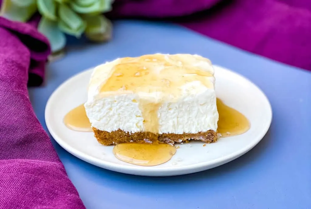 keto low carb salted caramel cheesecake on a white plate