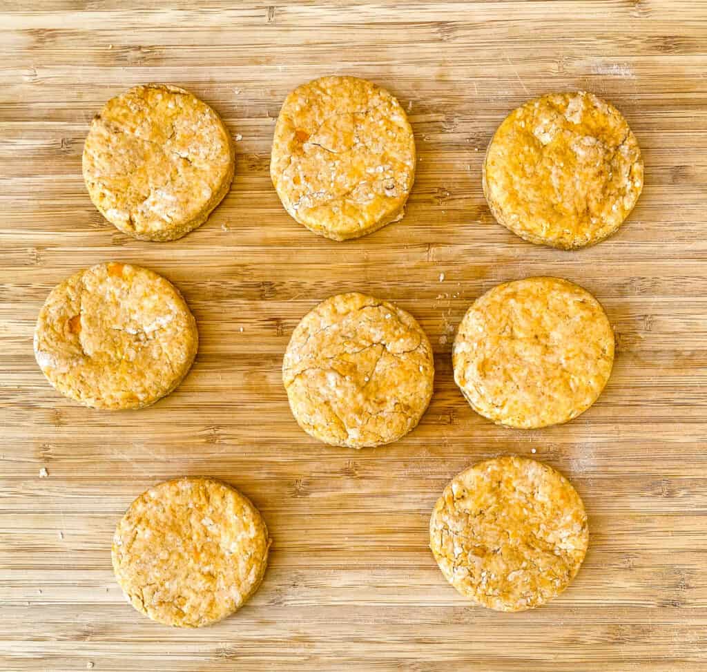 unbaked sweet potato biscuits on a bamboo cutting board