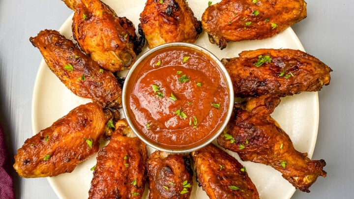 air fryer bbq chicken on a plate with bbq sauce