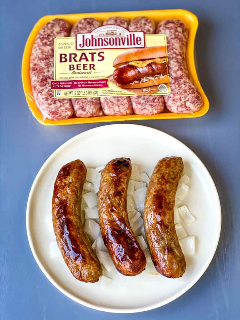 air fryer brats on a plate with onions