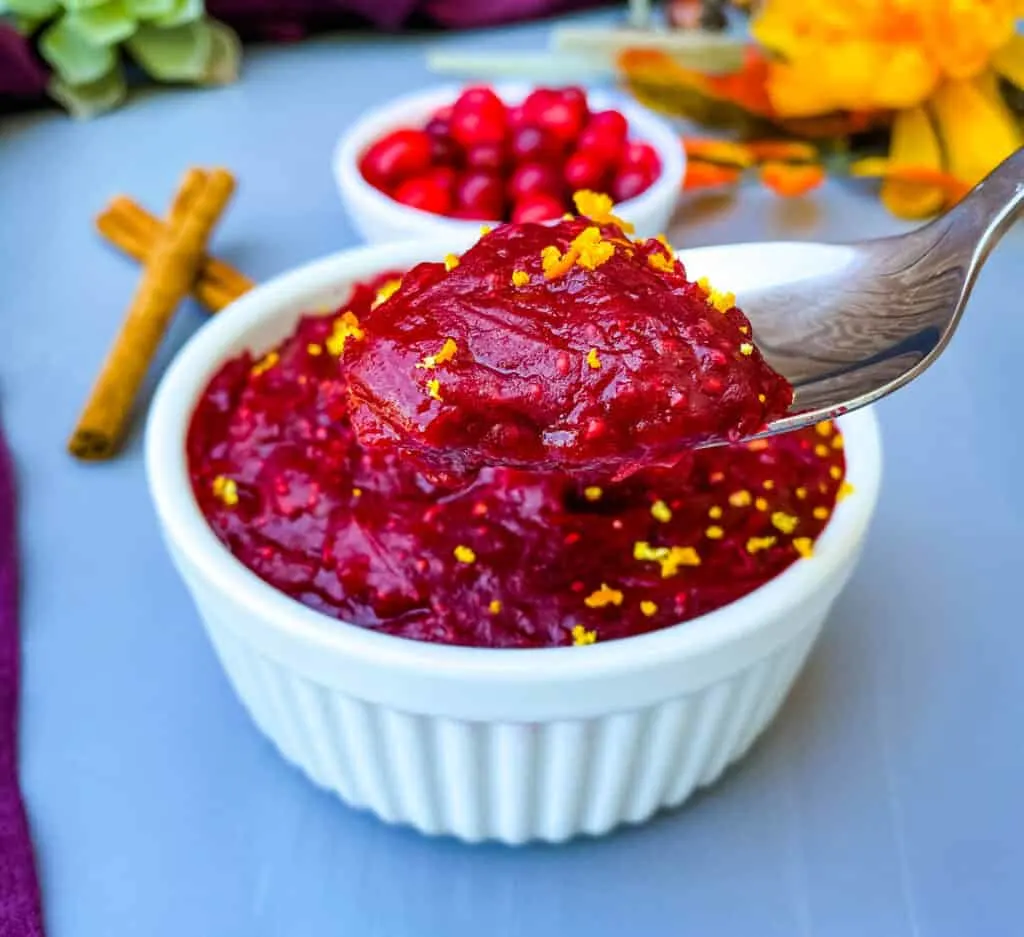 person holding a spoon of Grand Marnier cranberry sauce