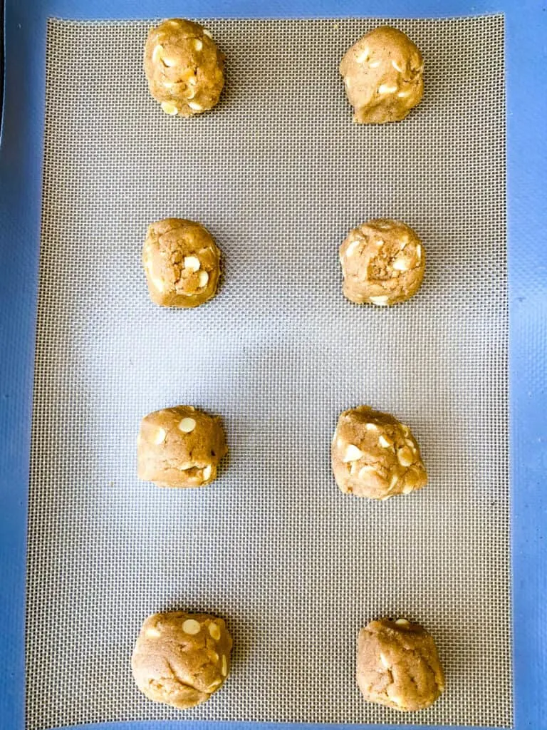 keto gingersnap cookies unbaked on a cookie sheet