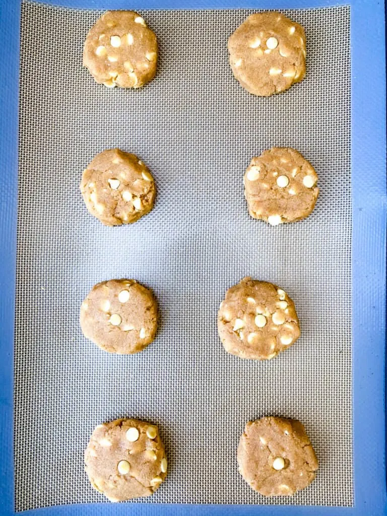 keto gingersnap cookies unbaked on a cookie sheet