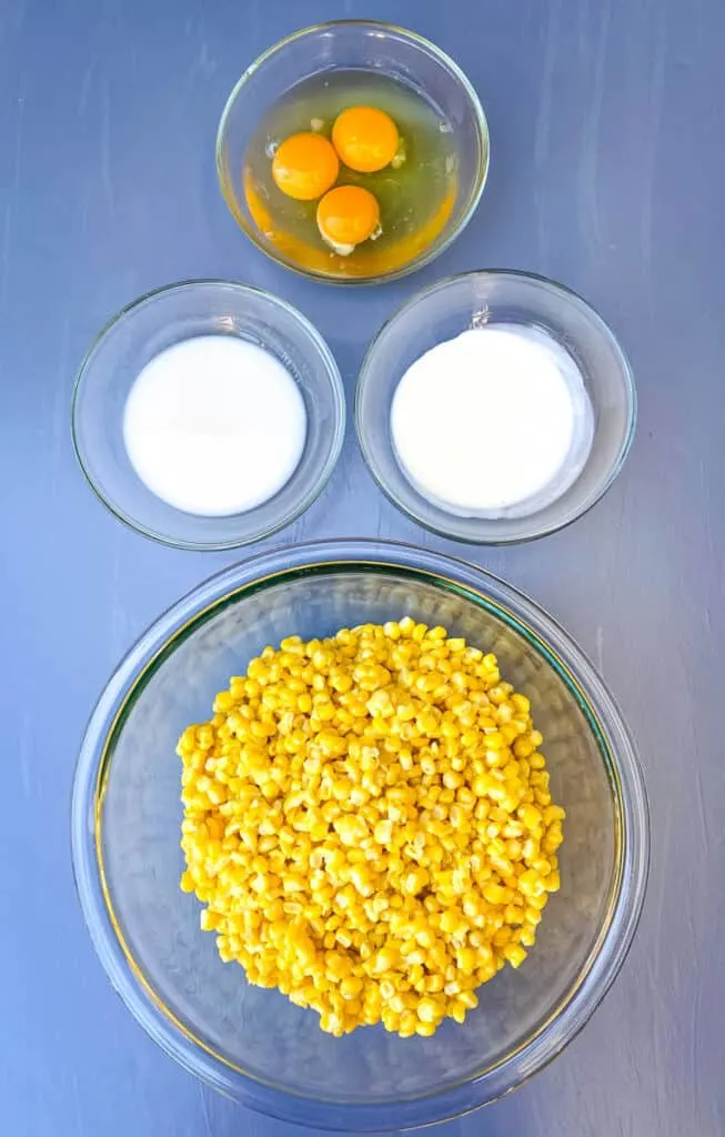 raw eggs, heavy whipping cream, almond milk, and whole kernel corn in separate bowls