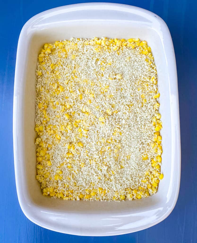 uncooked scalloped corn in a baking dish