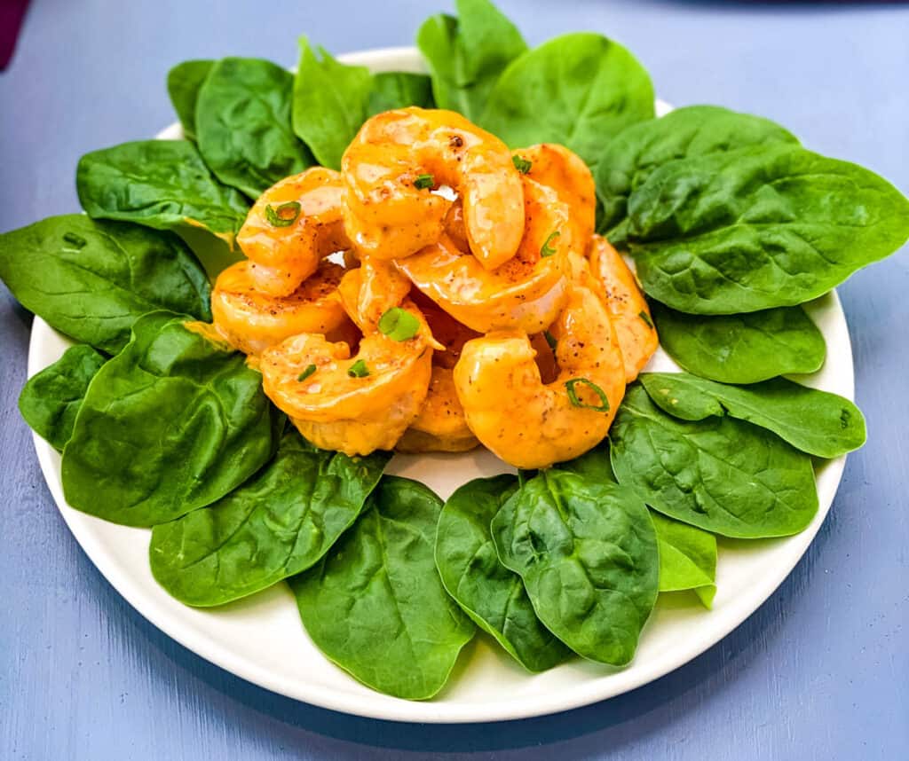 low carb buffalo shrimp on a bed of lettuce