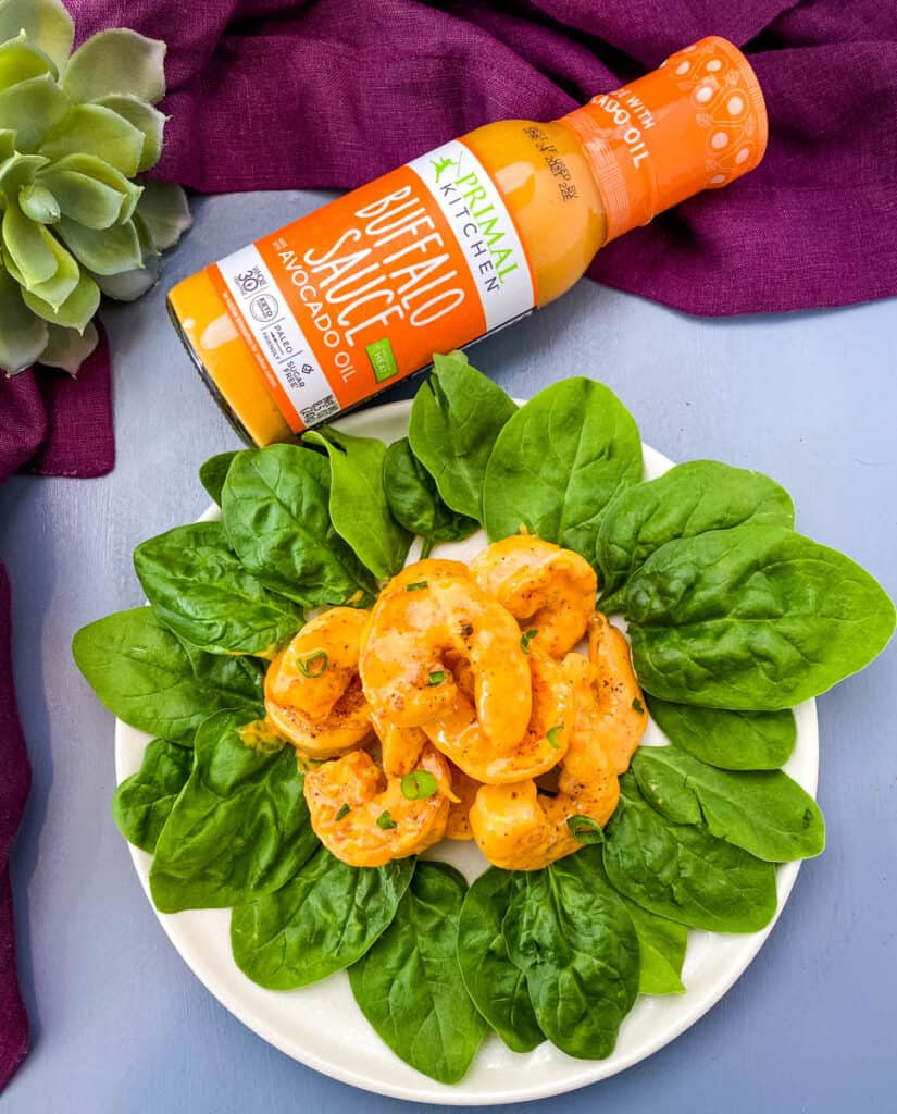 low carb buffalo shrimp on a bed of lettuce