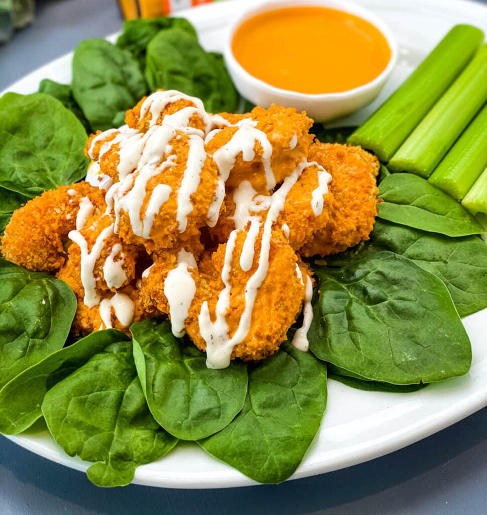 buffalo shrimp on a plate with ranch dressing
