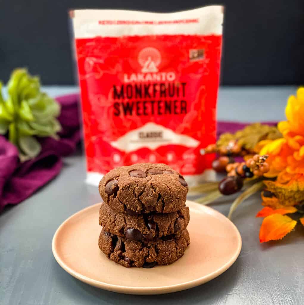 keto low carb double chocolate cookies on a pink plate with a purple napkin