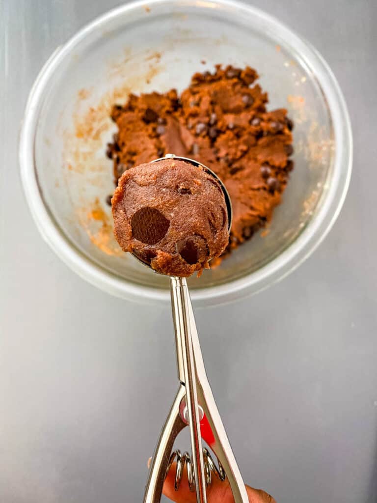 a scoop of unbaked keto chocolate cookie dough