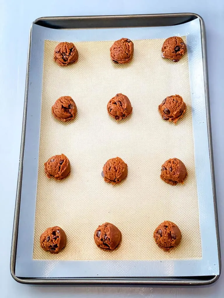 unbaked keto chocolate cookie dough on a cookie sheet