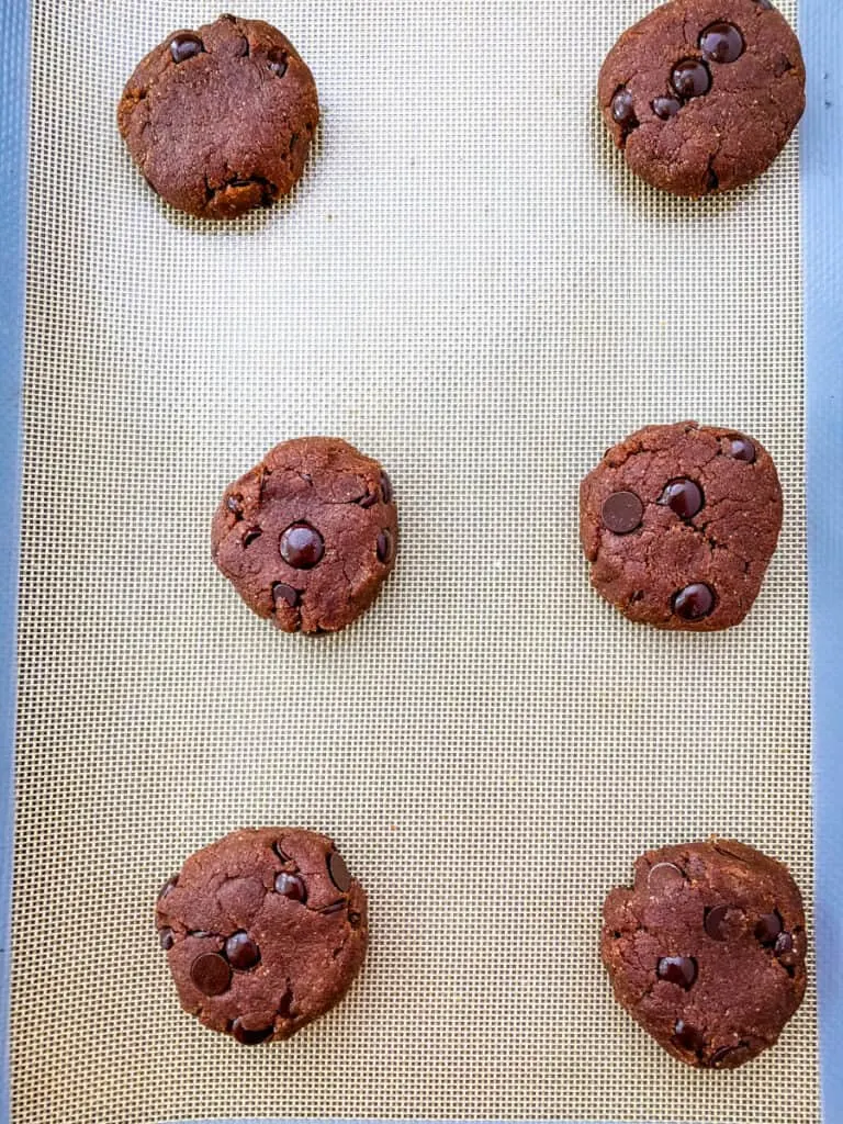 unbaked keto chocolate cookie dough on a cookie sheet