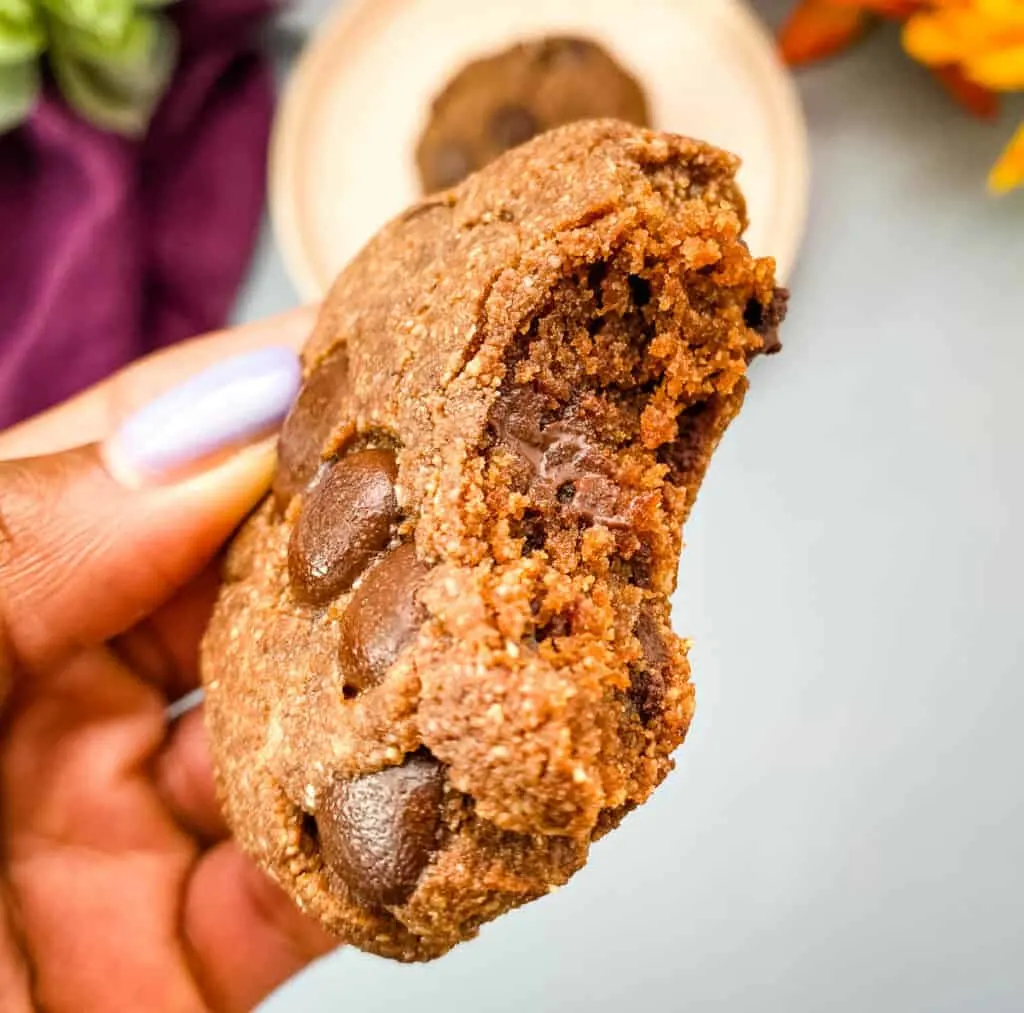 person holding keto double chocolate cookie