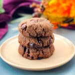 keto low carb double chocolate cookies on a pink plate with a purple napkin
